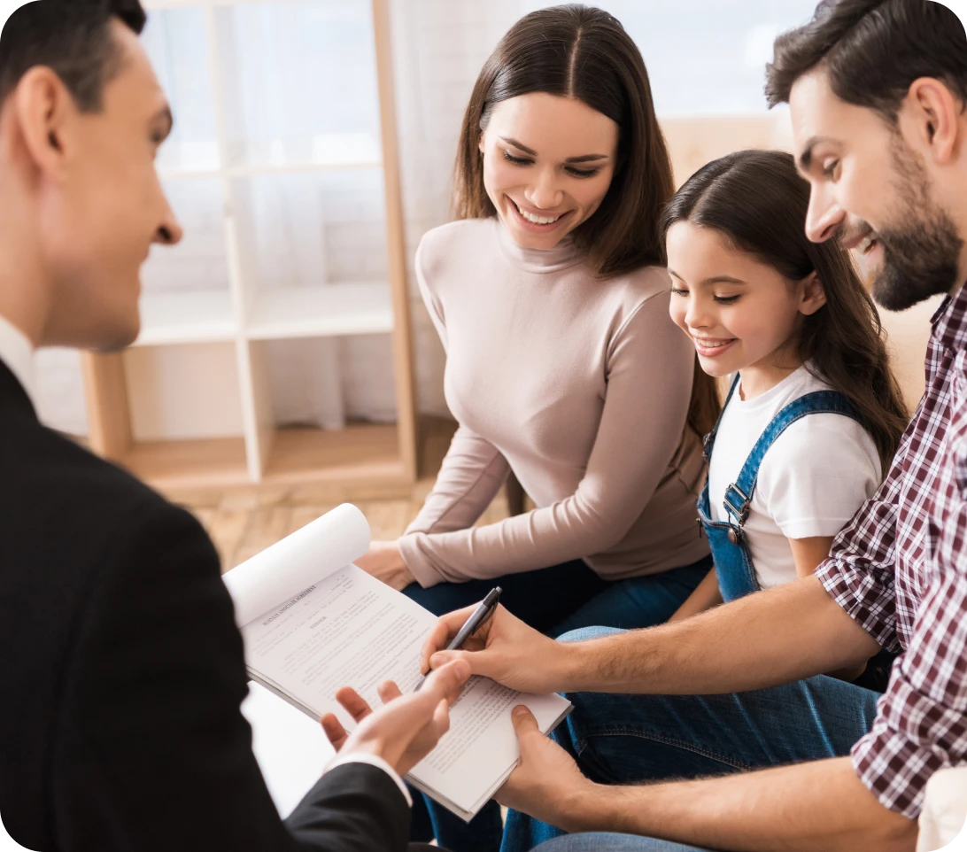Lawyer assisting parents with family legal agreement and paperwork.