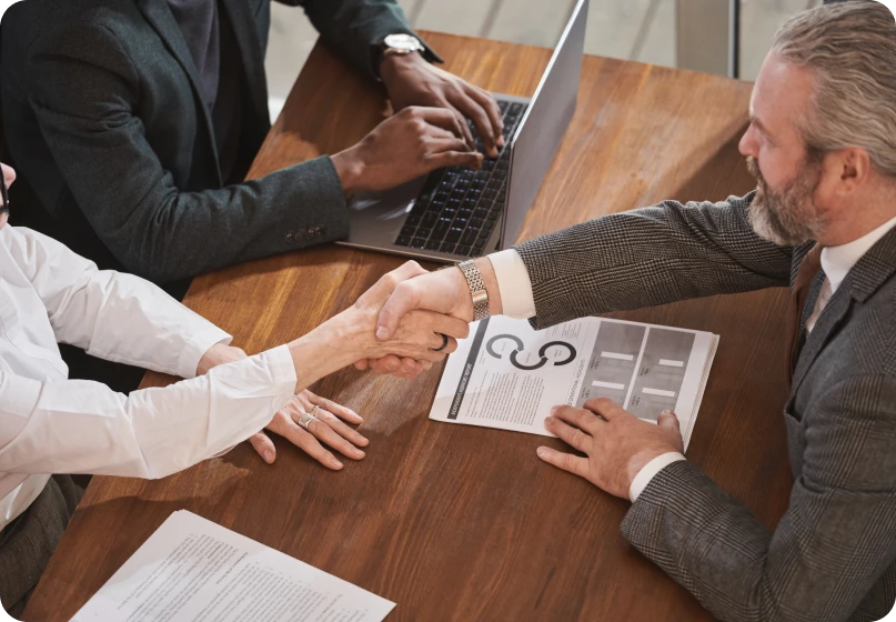 Family law lawyer advising a couple on joint venture and trust claims during a legal consultation.