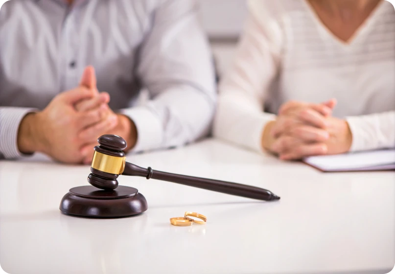Courtroom gavel and rings symbolizing enforcement of legal rights in fraudulent marriages.