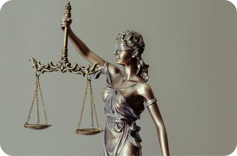 Justice statue close‑up symbolizing legal claims for joint ventures and trusts.