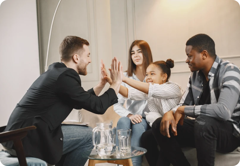 Family meeting with lawyer to discuss collaborative family law and divorce agreements.